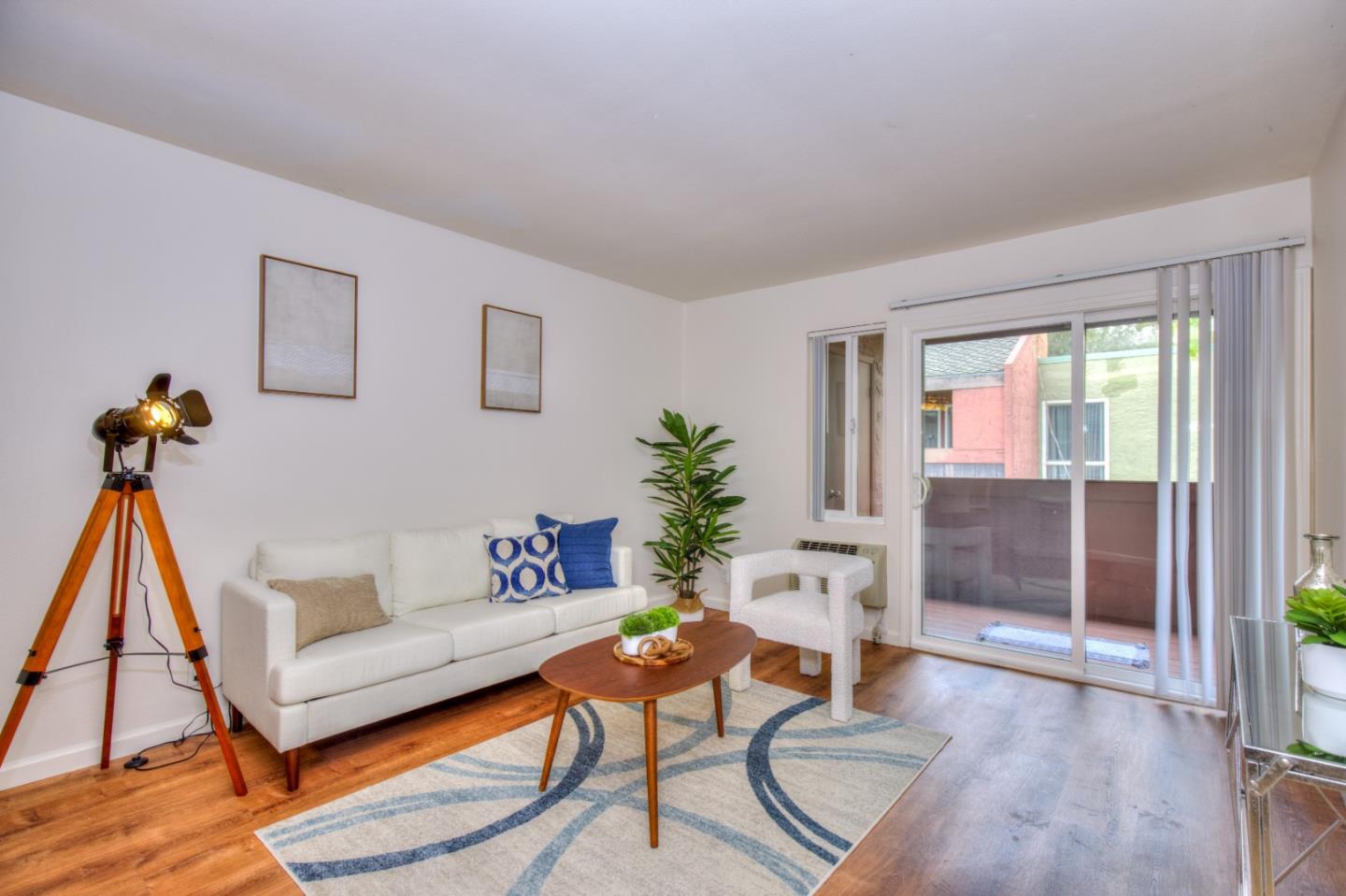 464 Dempsey Road, Unit 264 Milpitas, CA 95035 - Photo 1 of 16 a living room with furniture and a wooden floor