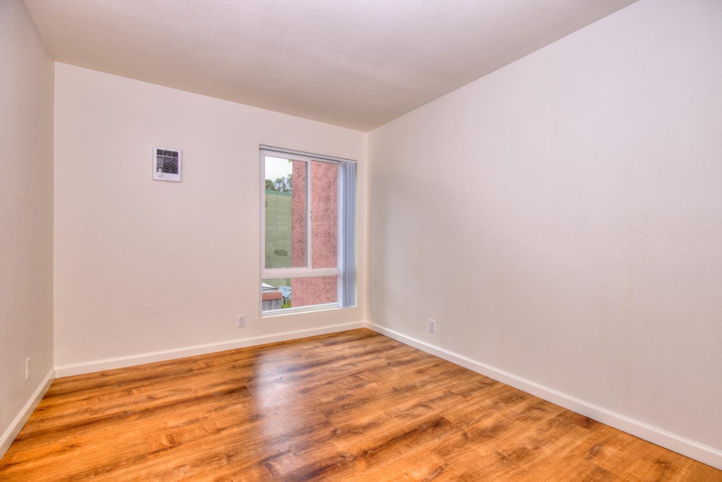 464 Dempsey Road, Unit 264 Milpitas, CA 95035 - Photo 14 of 16 a view of an empty room and window