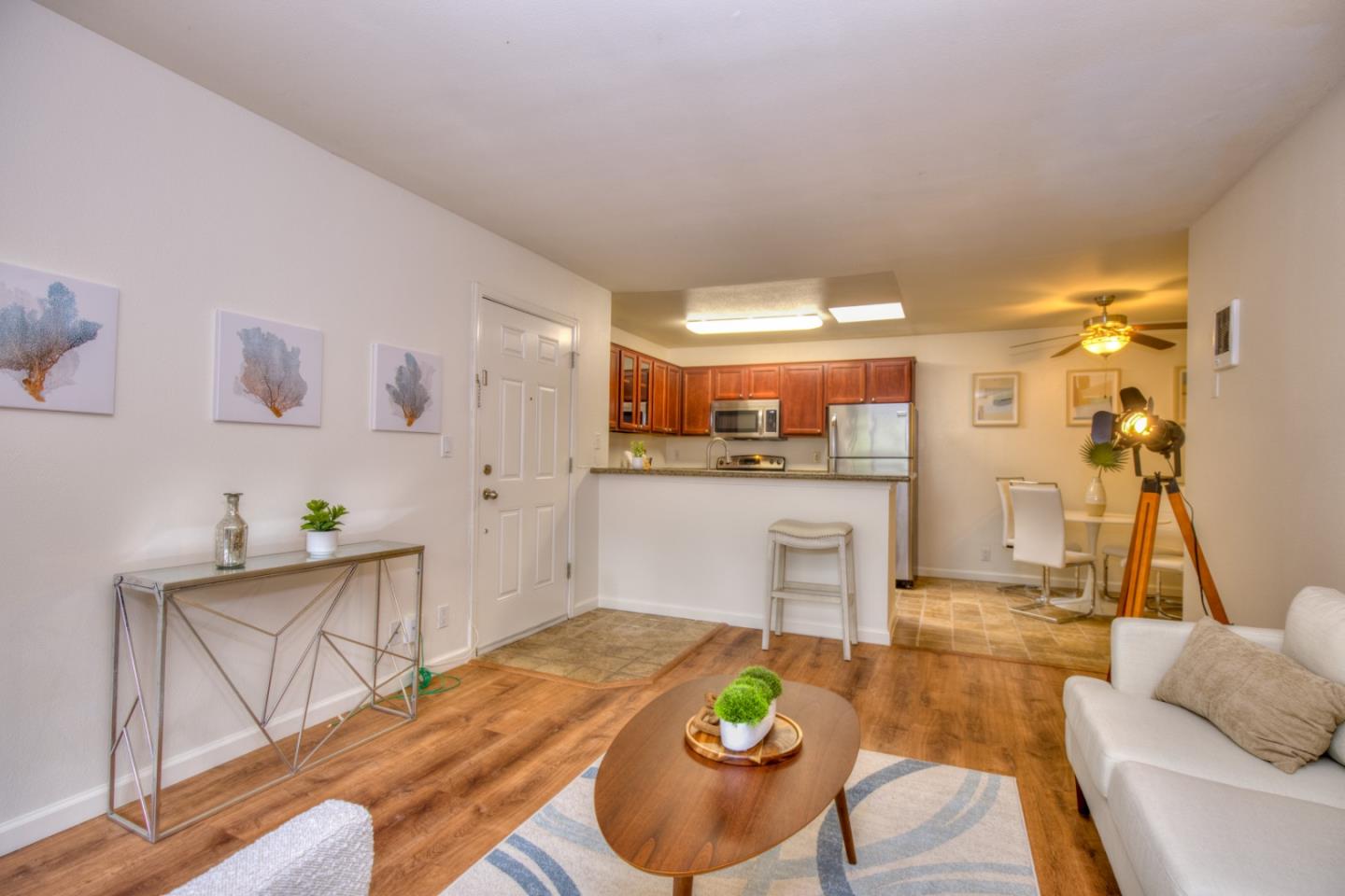 464 Dempsey Road, Unit 264 Milpitas, CA 95035 - Photo 4 of 16 a living room with furniture and kitchen view