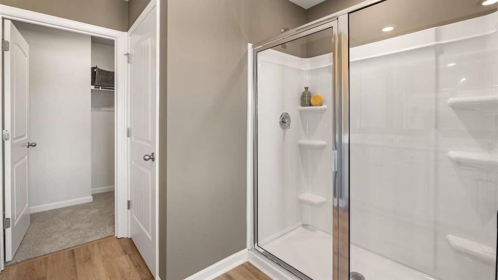 4937 Jatoba Road Acworth, GA 30101 - Photo 14 of 22 a bathroom with a shower and a glass door