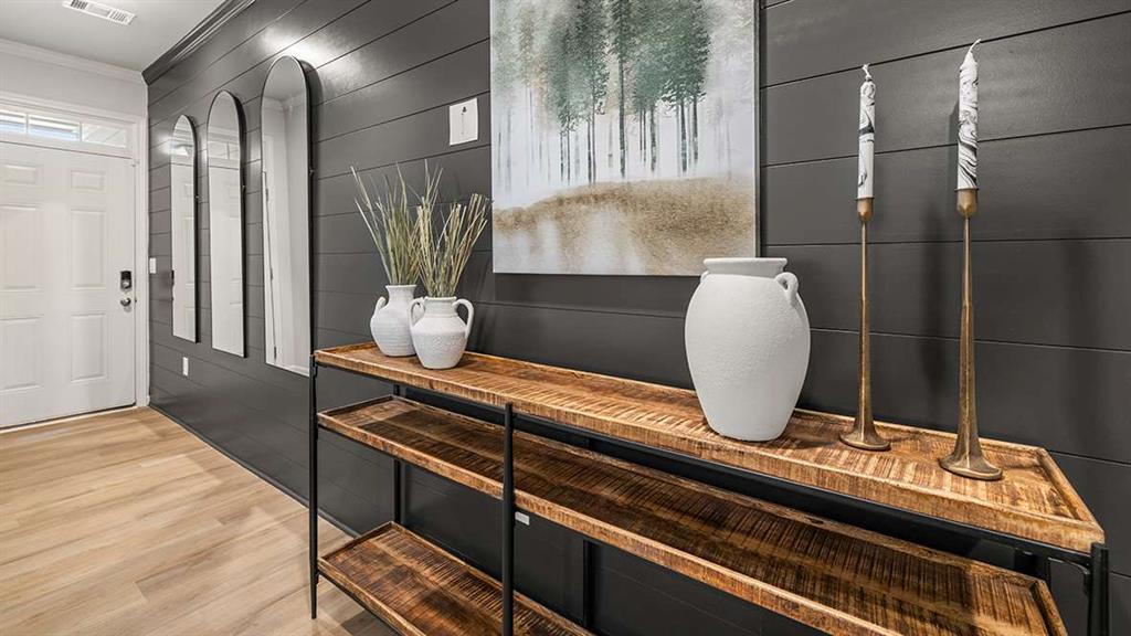 4937 Jatoba Road Acworth, GA 30101 - Photo 3 of 22 a room with wooden floor and potted plant