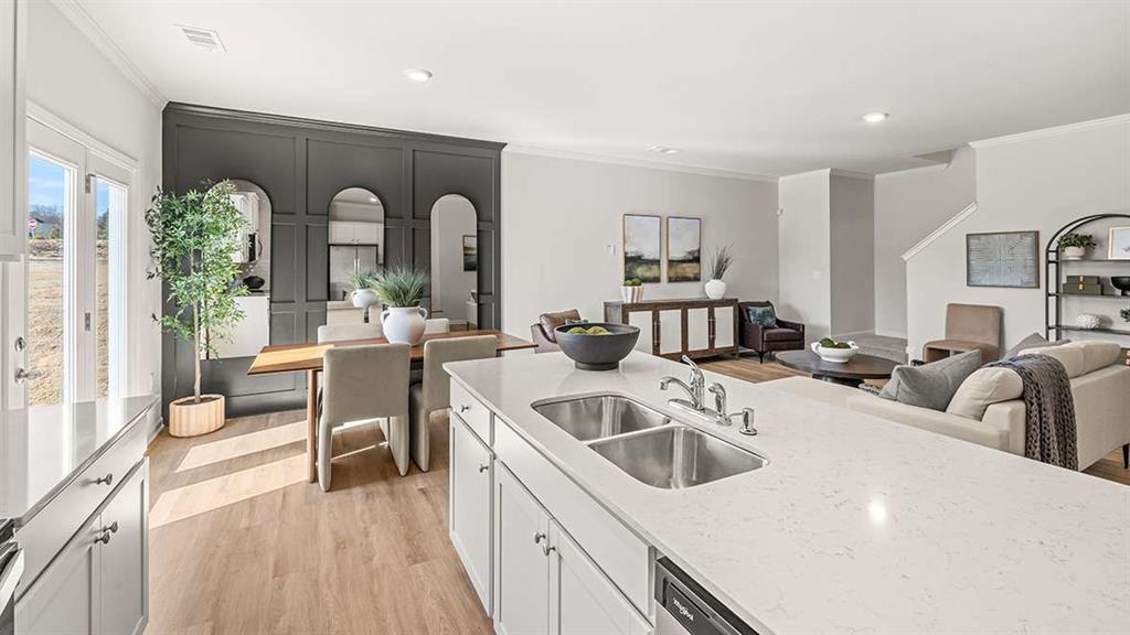4937 Jatoba Road Acworth, GA 30101 - Photo 7 of 22 a view of a kitchen with a sink and living room