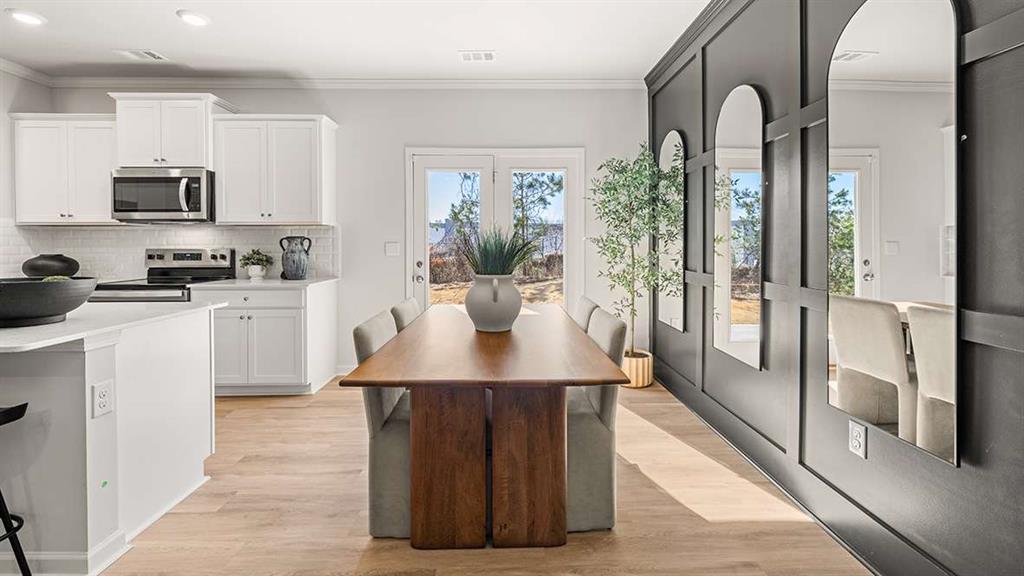 4937 Jatoba Road Acworth, GA 30101 - Photo 8 of 22 a kitchen with stainless steel appliances a sink stove and refrigerator