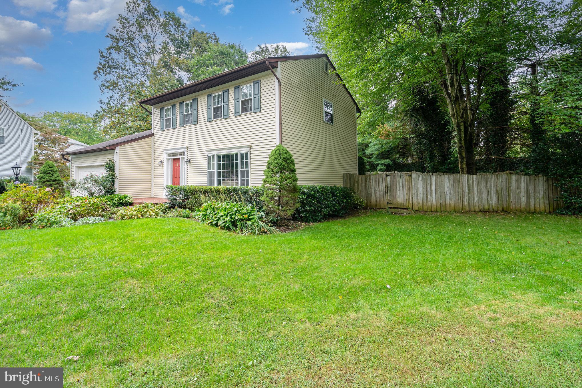 4530 Rincon Place Dumfries, VA 22025 - Photo 1 of 45 a front view of a house with garden