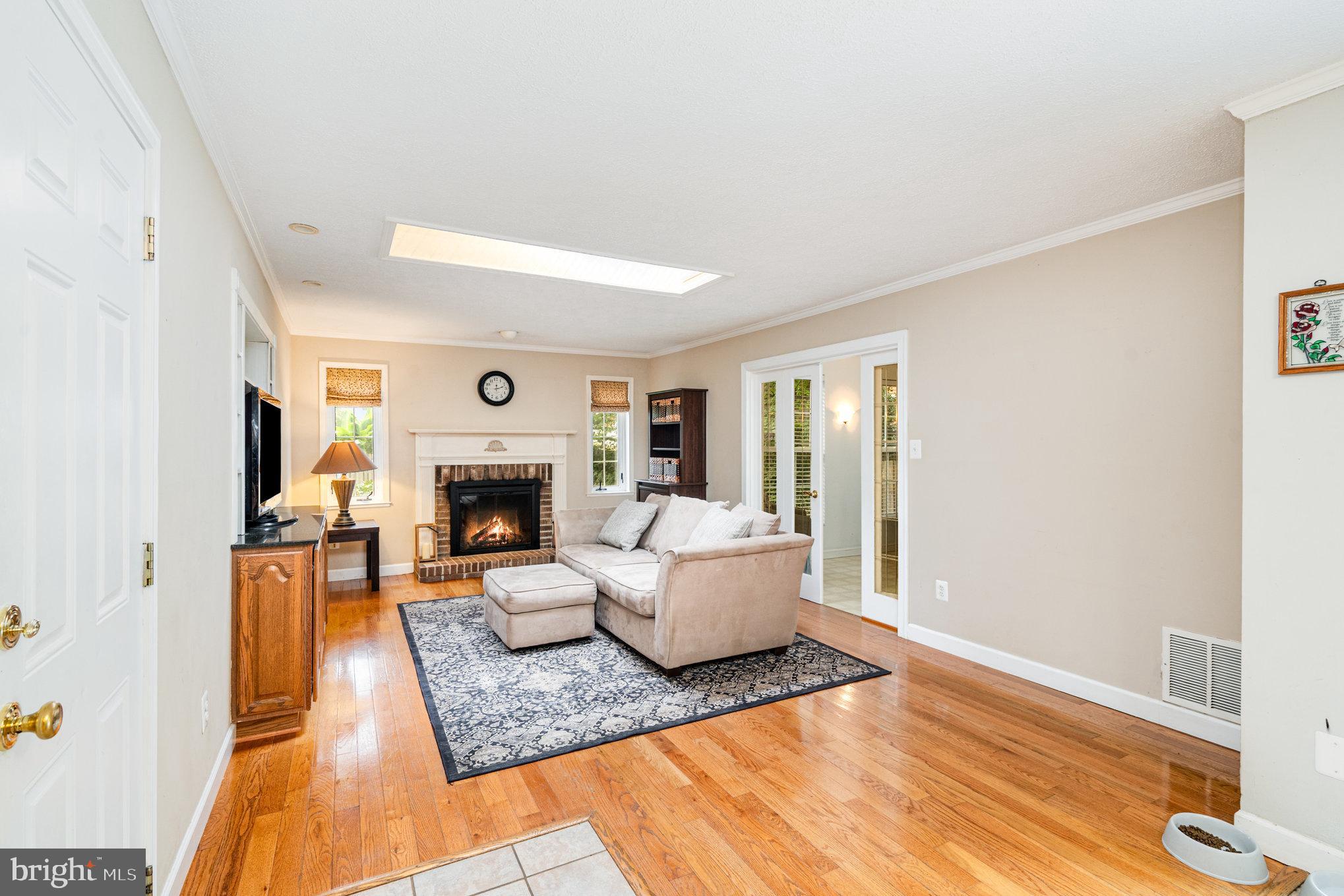 4530 Rincon Place Dumfries, VA 22025 - Photo 14 of 45 a living room with furniture and a fireplace