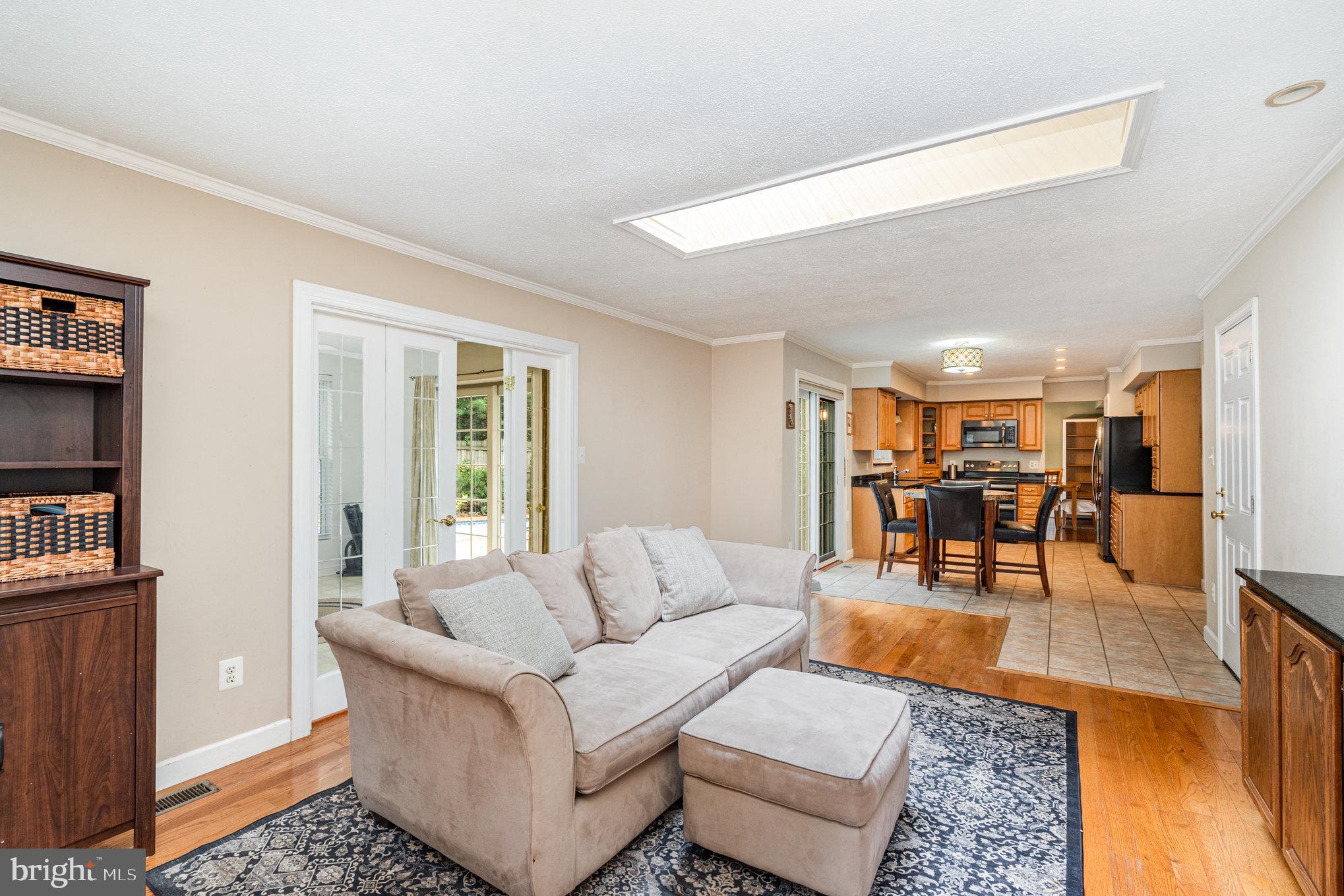 4530 Rincon Place Dumfries, VA 22025 - Photo 16 of 45 a living room with furniture and a table
