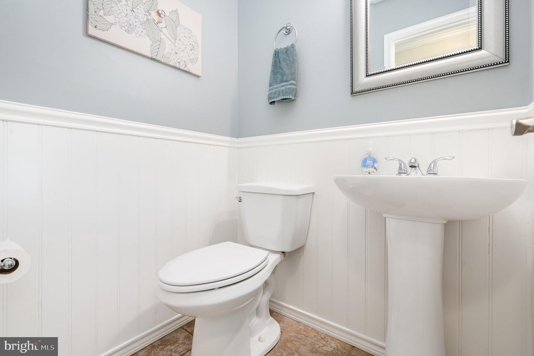 4530 Rincon Place Dumfries, VA 22025 - Photo 19 of 45 a bathroom with a sink mirror and toilet