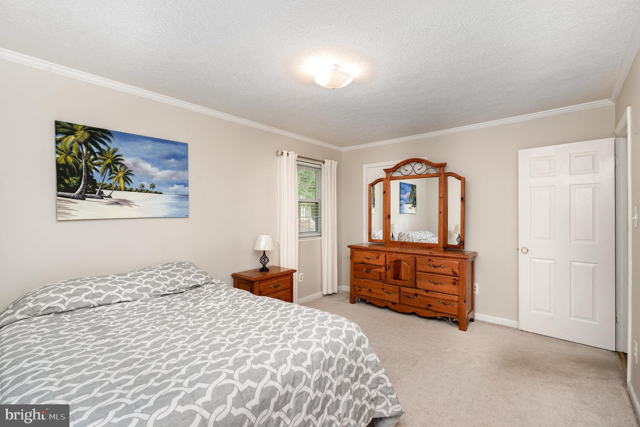 4530 Rincon Place Dumfries, VA 22025 - Photo 20 of 45 a bedroom with a bed and dresser