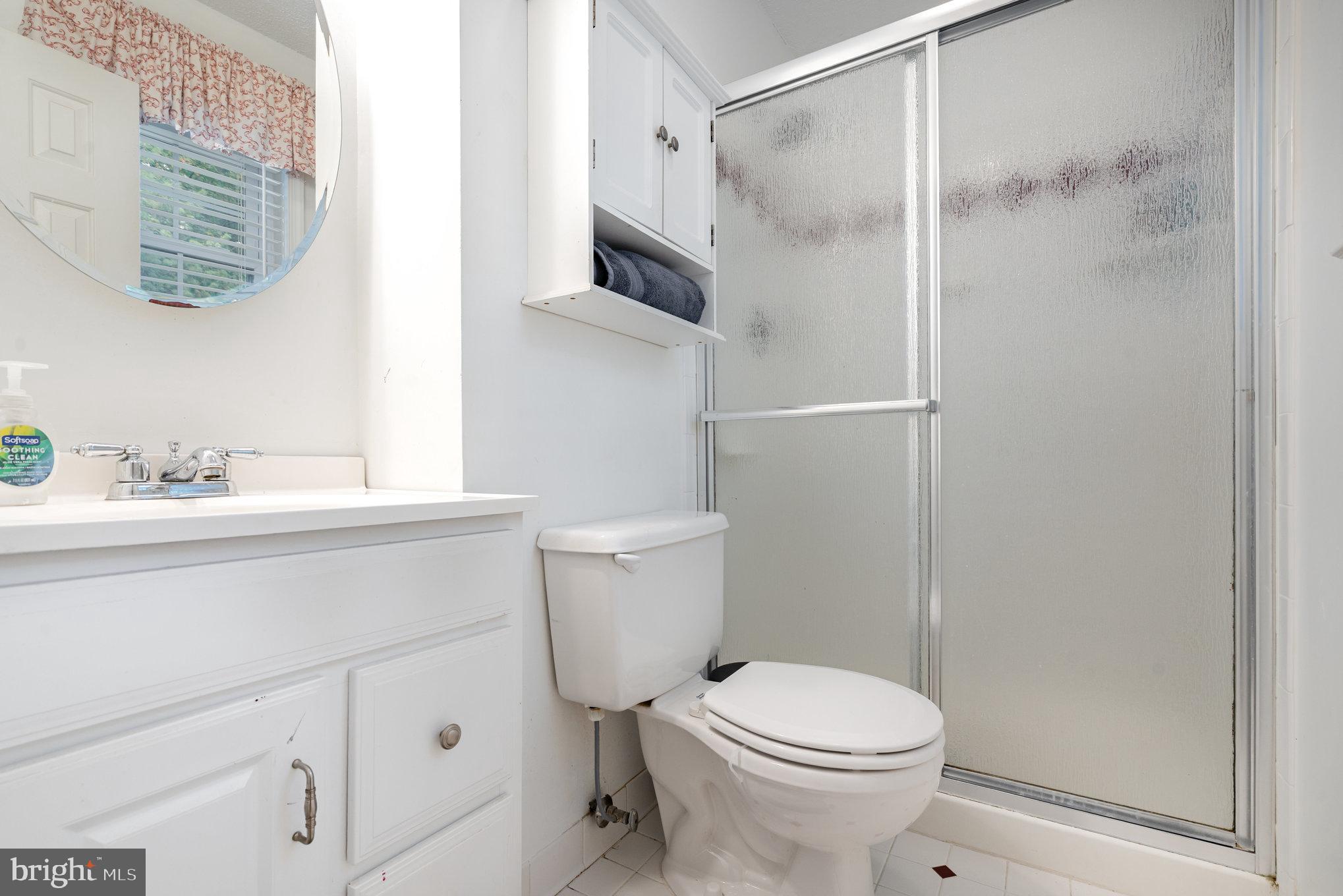 4530 Rincon Place Dumfries, VA 22025 - Photo 22 of 45 a bathroom with a sink a toilet and shower