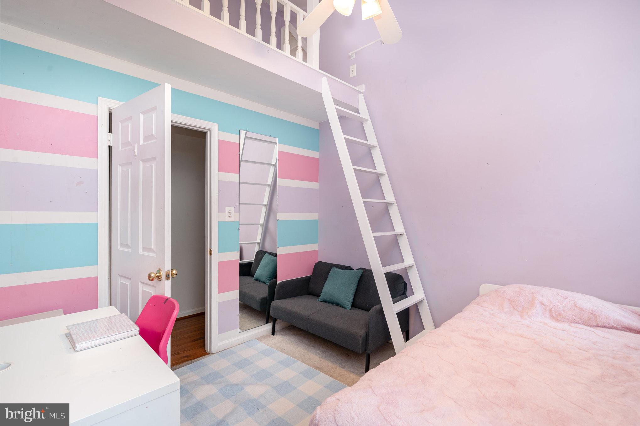 4530 Rincon Place Dumfries, VA 22025 - Photo 24 of 45 a bedroom with a bed a couch and a window