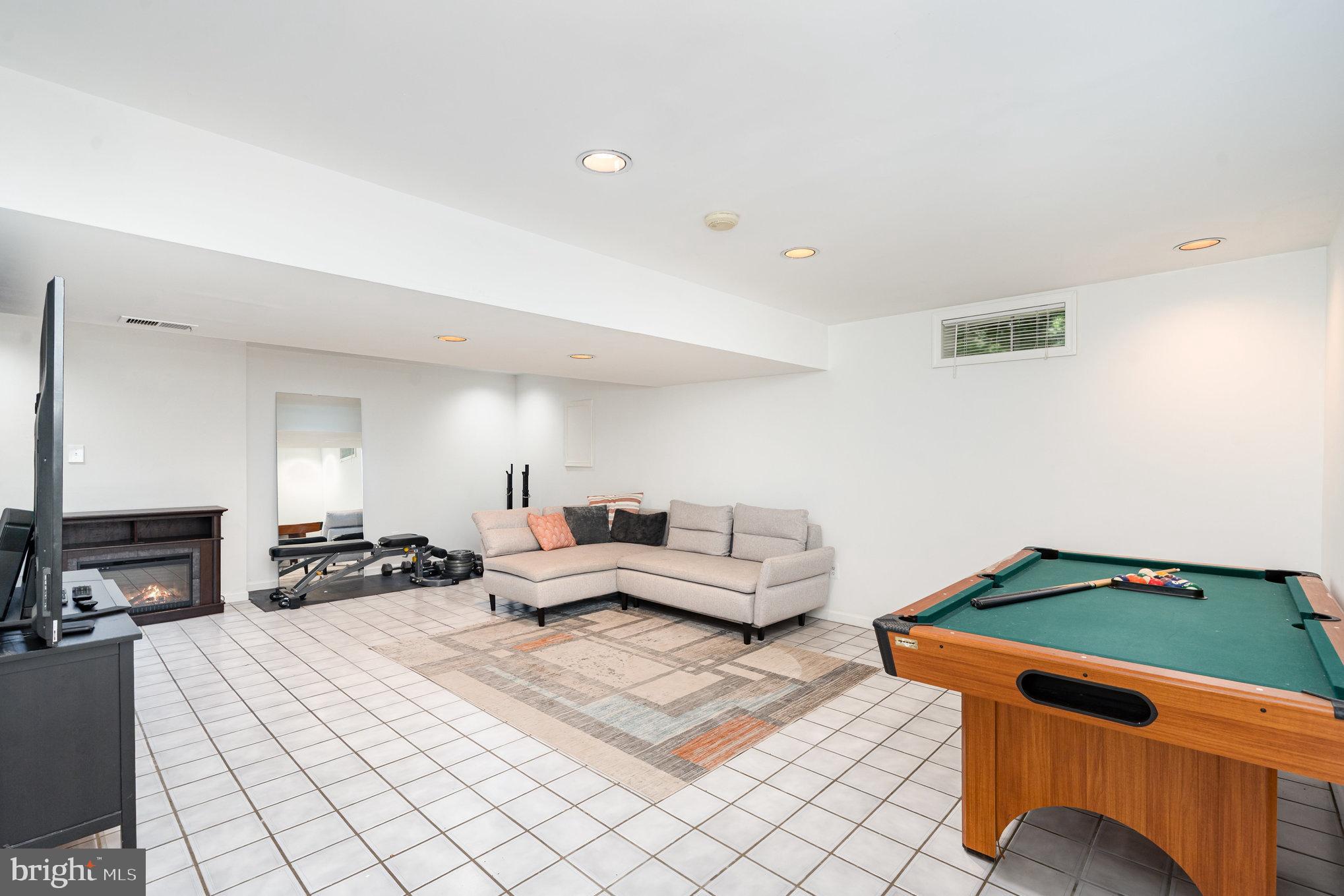 4530 Rincon Place Dumfries, VA 22025 - Photo 31 of 45 a bedroom with furniture and a lamp