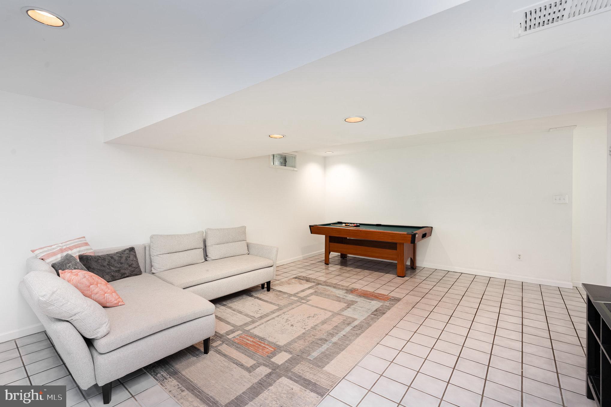 4530 Rincon Place Dumfries, VA 22025 - Photo 32 of 45 a living room with a couch and a rug
