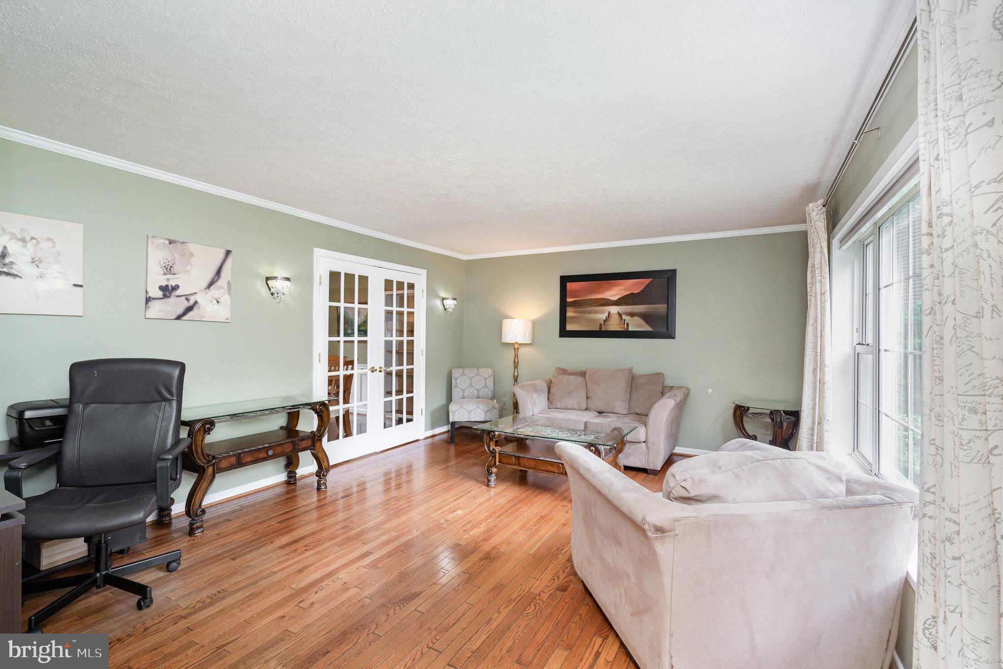 4530 Rincon Place Dumfries, VA 22025 - Photo 4 of 45 a living room with furniture and a window