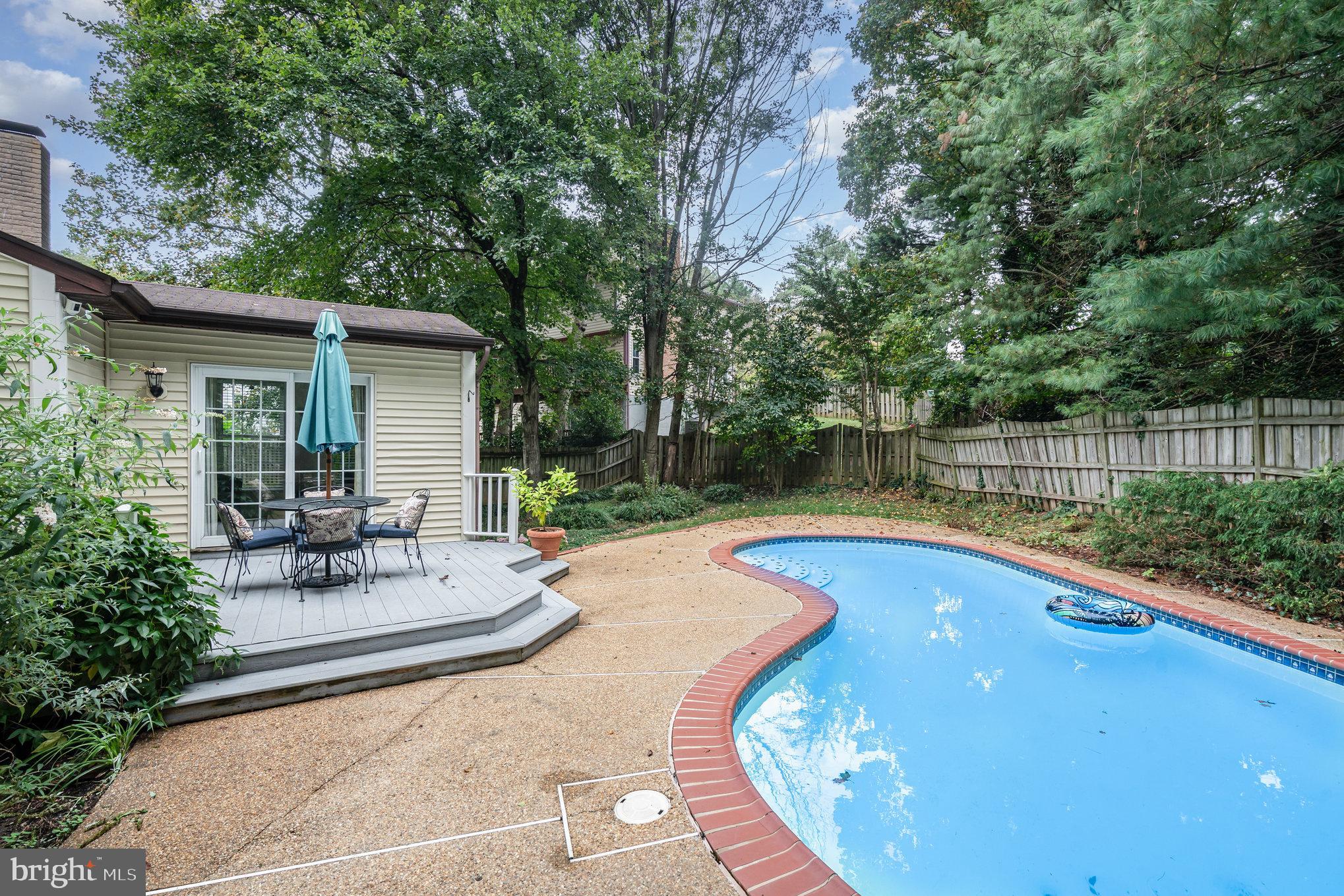 4530 Rincon Place Dumfries, VA 22025 - Photo 42 of 45 a view of pool with lawn chairs and plants