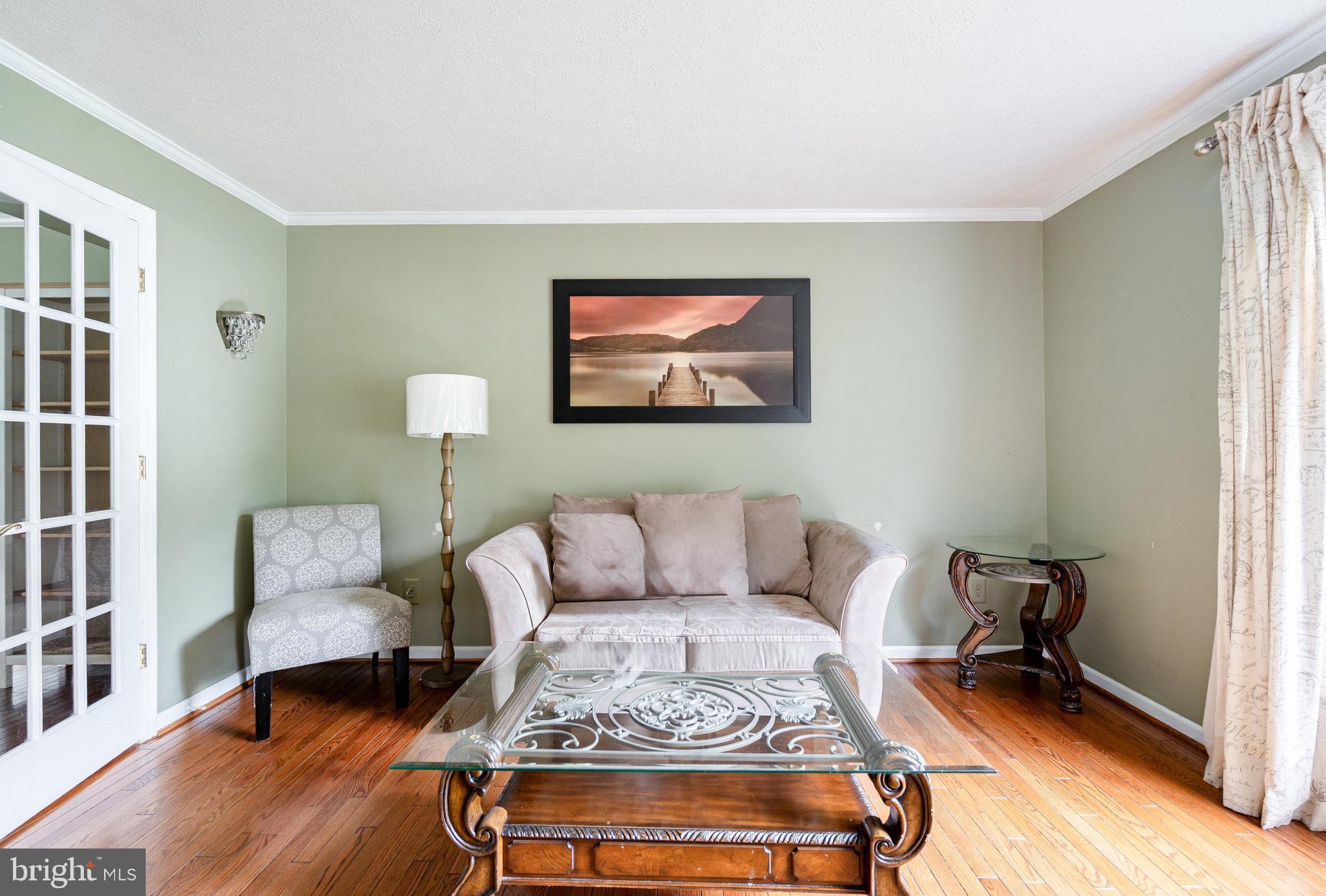4530 Rincon Place Dumfries, VA 22025 - Photo 5 of 45 a living room with furniture and a rug
