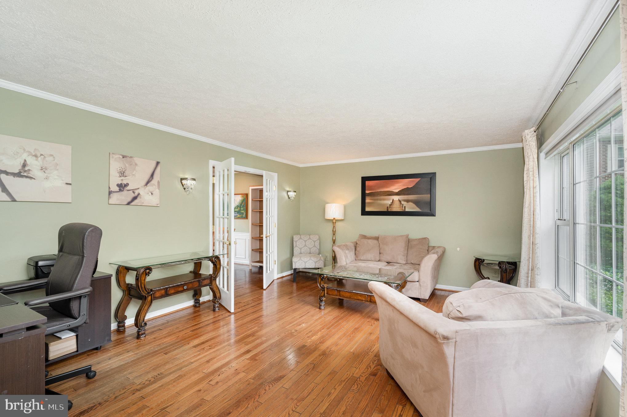4530 Rincon Place Dumfries, VA 22025 - Photo 6 of 45 a living room with furniture and a wooden floor