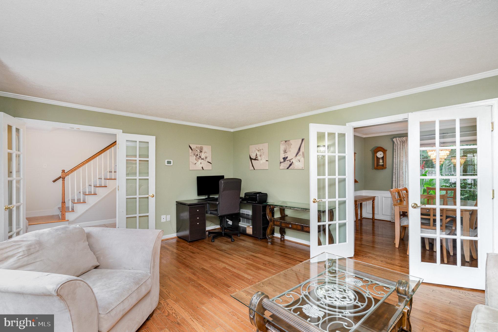4530 Rincon Place Dumfries, VA 22025 - Photo 7 of 45 a living room with furniture and a table