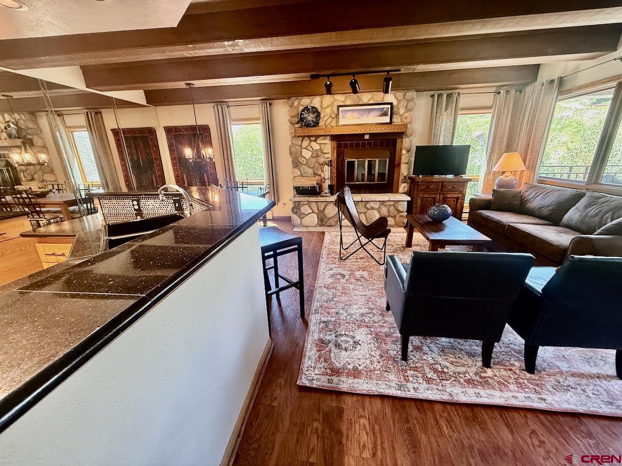 11 Snowmass Road, Unit 337 Crested Butte, CO 81225 - Photo 14 of 35 a living room with furniture and a large window