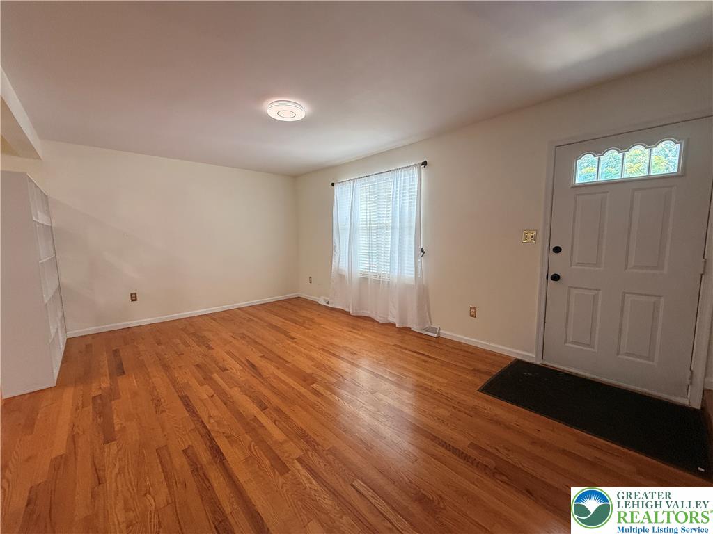 170 Springhouse Road Allentown, PA 18104 - Photo 3 of 23 Rich hardwood floors welcome you into this warm and inviting living space.