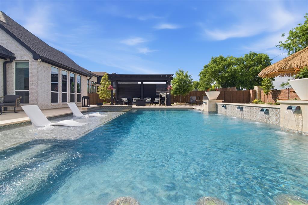 1920 Lotus Court Haslet, TX 76052 - Photo 27 of 40 Inviting pool with beach entry, sundeck, swim up bar, water features.
