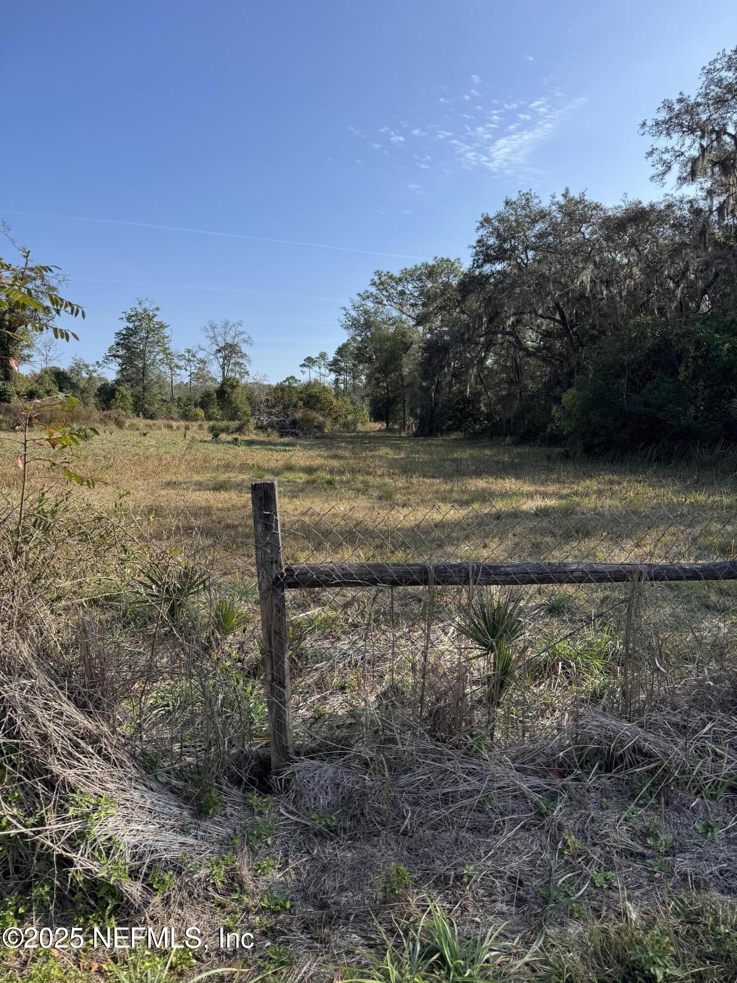 a view of a yard with an outdoor space