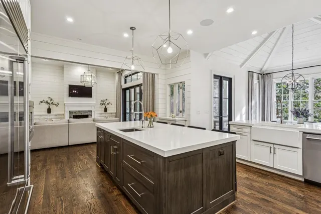 a large kitchen with a table and chairs