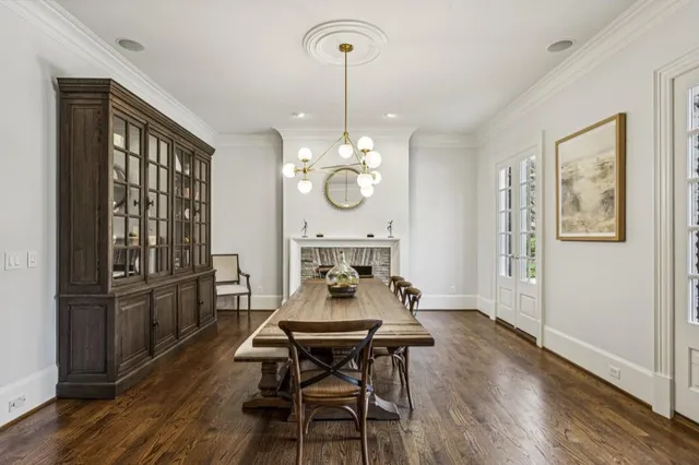 a kitchen with stainless steel appliances granite countertop a sink and a white cabinets