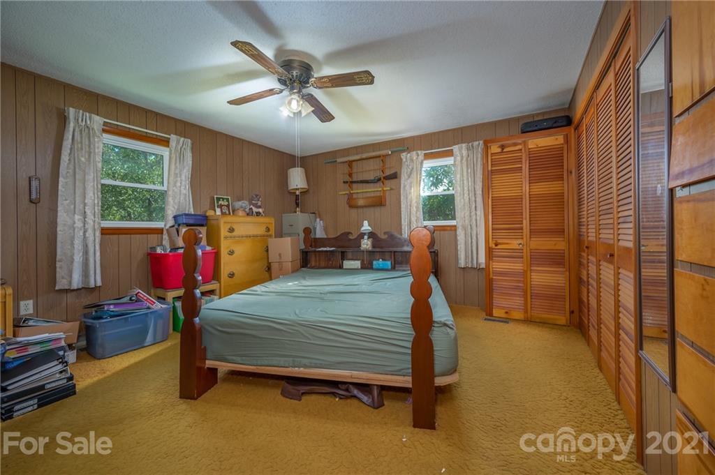 4771 Highway 9 Mill Spring, NC 28756 - Photo 11 of 35 a bedroom with bed and glass door
