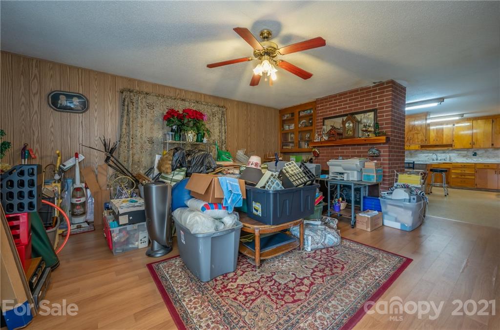4771 Highway 9 Mill Spring, NC 28756 - Photo 5 of 35 a living room with furniture and a flat screen tv