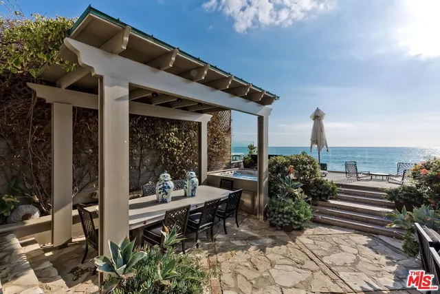 a patio with table and chairs