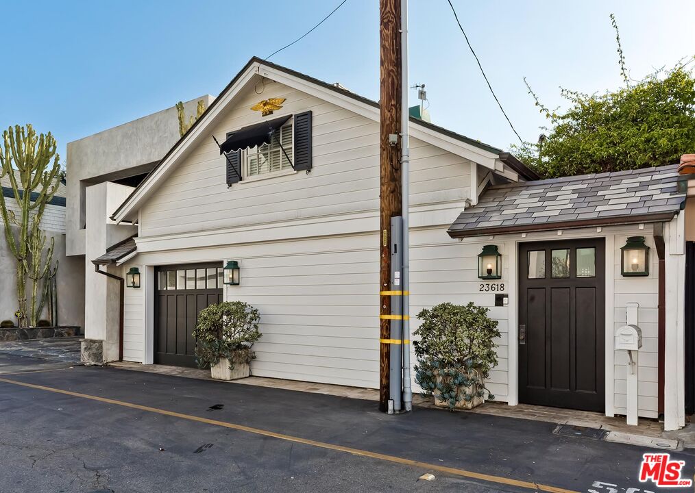 23618 Malibu Colony Road, Unit 56 Malibu, CA 90265 - Photo 29 of 29 a front view of a house with garden