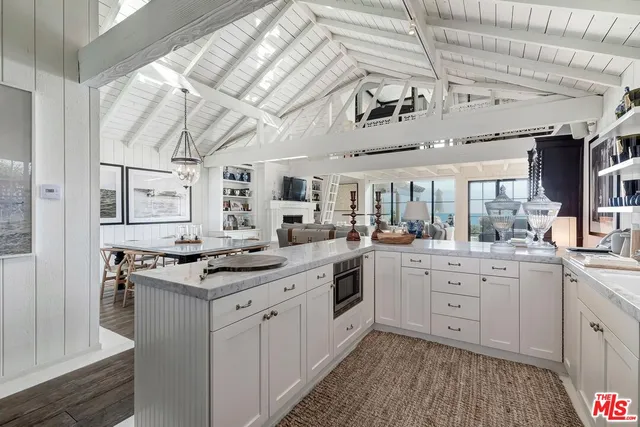 a kitchen with stainless steel appliances granite countertop a sink and cabinets