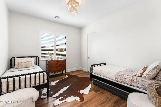 a bedroom with furniture and a window
