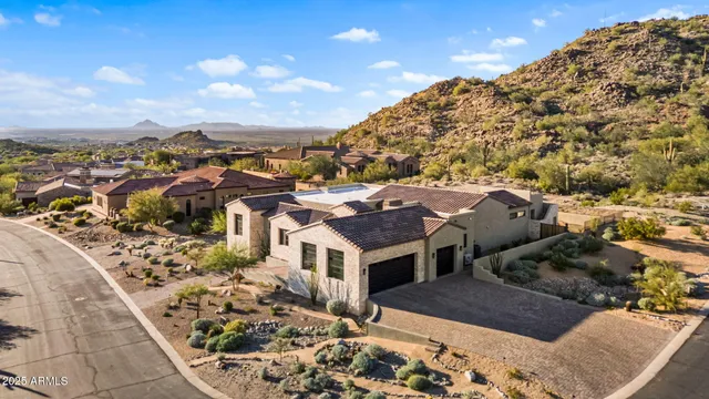 a view of a dining room with furniture a chandelier and wooden floor