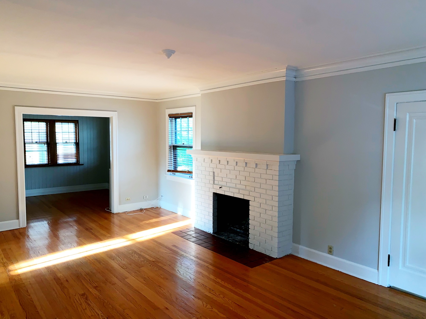 161 E Road Glen Ellyn, IL 60137 - Photo 3 of 13 a view of an empty room with window and fire place