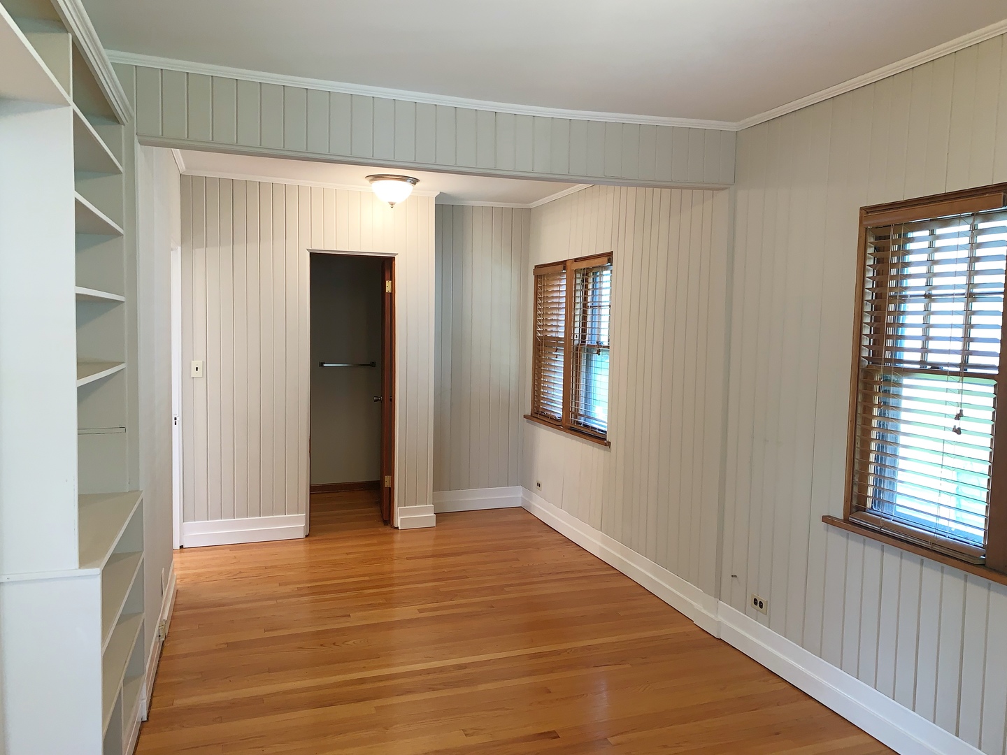 161 E Road Glen Ellyn, IL 60137 - Photo 4 of 13 a view of an empty room with wooden floor and a window