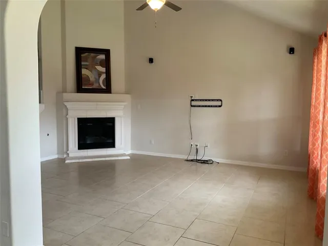 a view of an empty room with windows