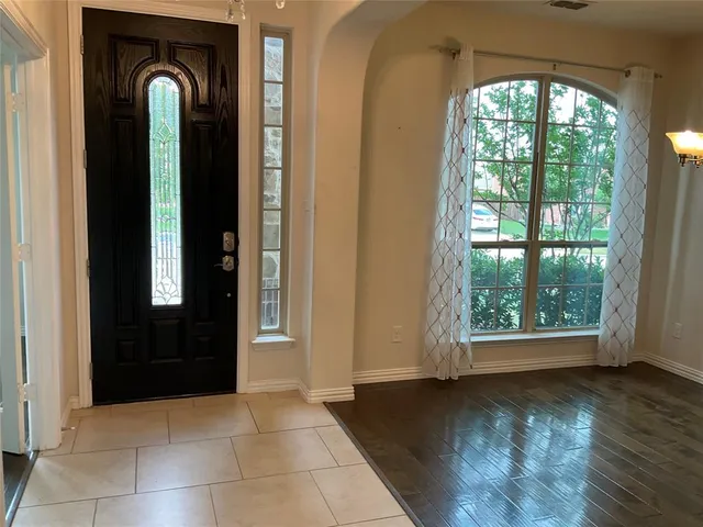 en view of empty room with wooden floor