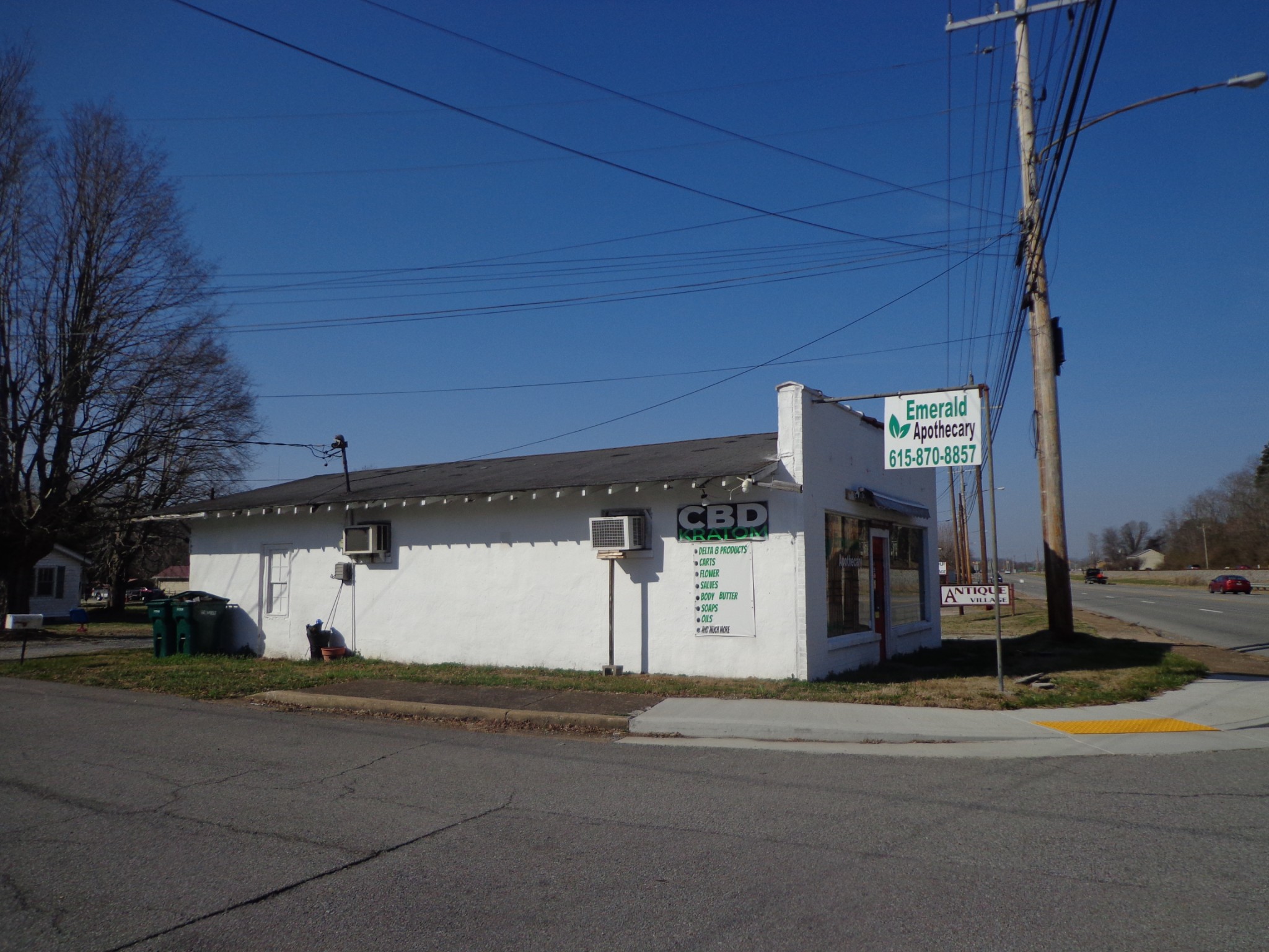 918 East Main Street Waverly, TN 37185 - Photo 6 of 14 a view of a building with car parked on the road