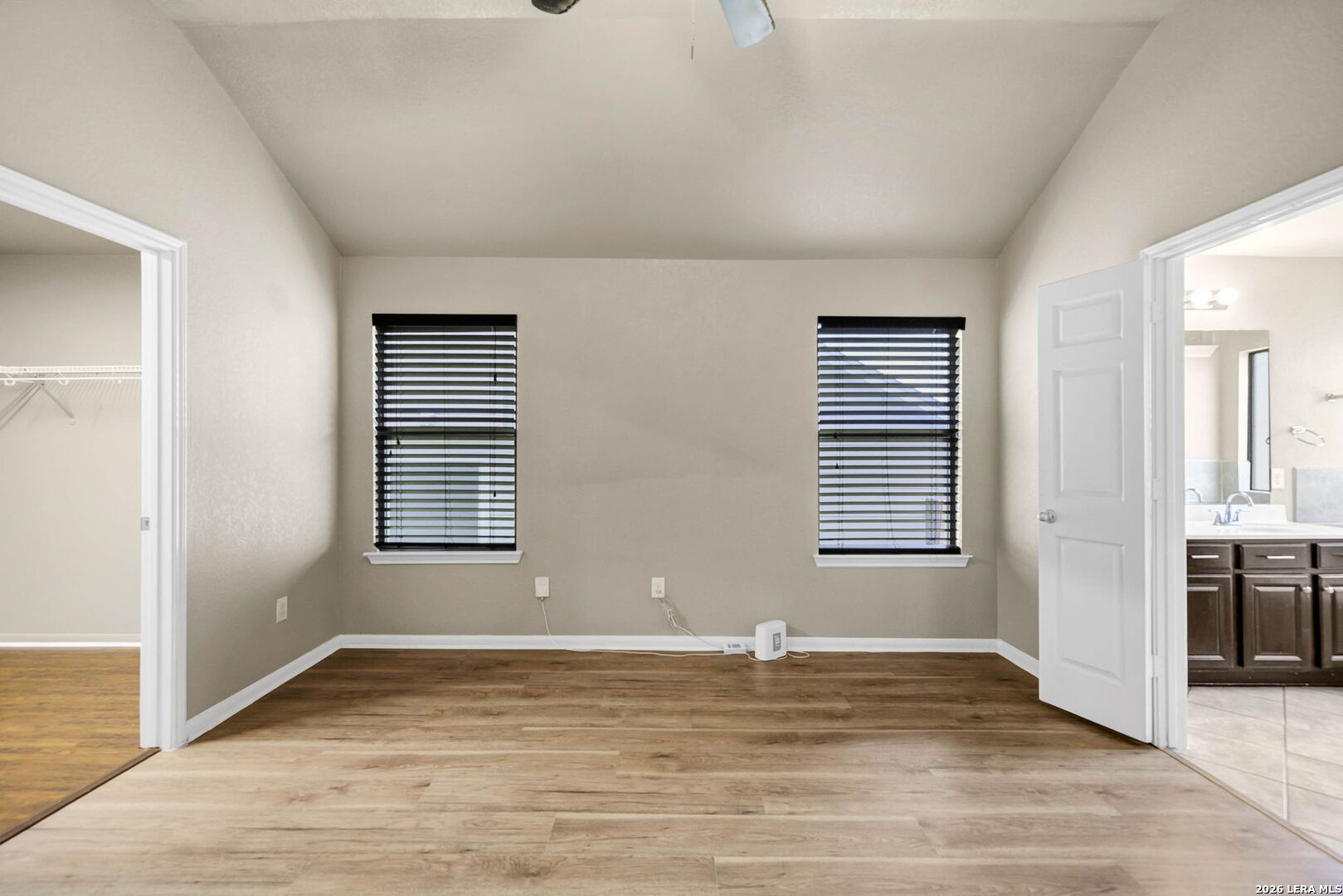 4015 Shervin Way Converse, TX 78109 - Photo 23 of 43 an empty room with wooden floor and windows