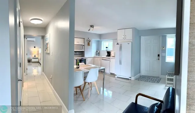 a large bed sitting in a bedroom next to a bathroom