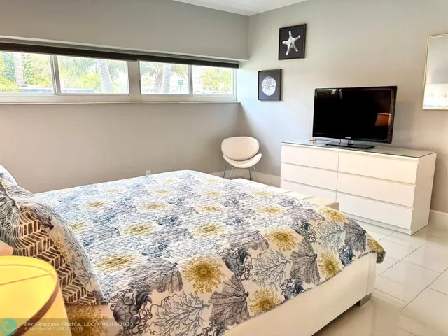 a bathroom with a sink and mirror with toilet