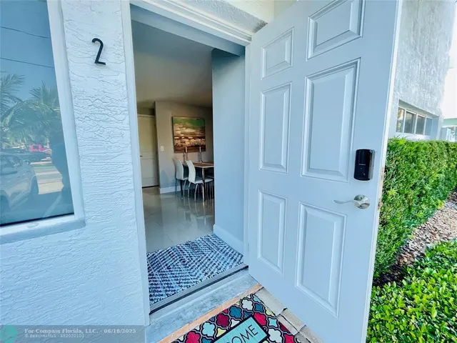a view of balcony and dining room