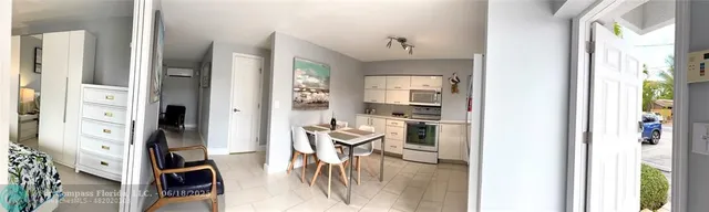 a view of a kitchen with furniture and a window