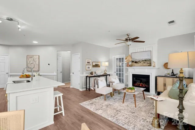 a living room with furniture and a fireplace