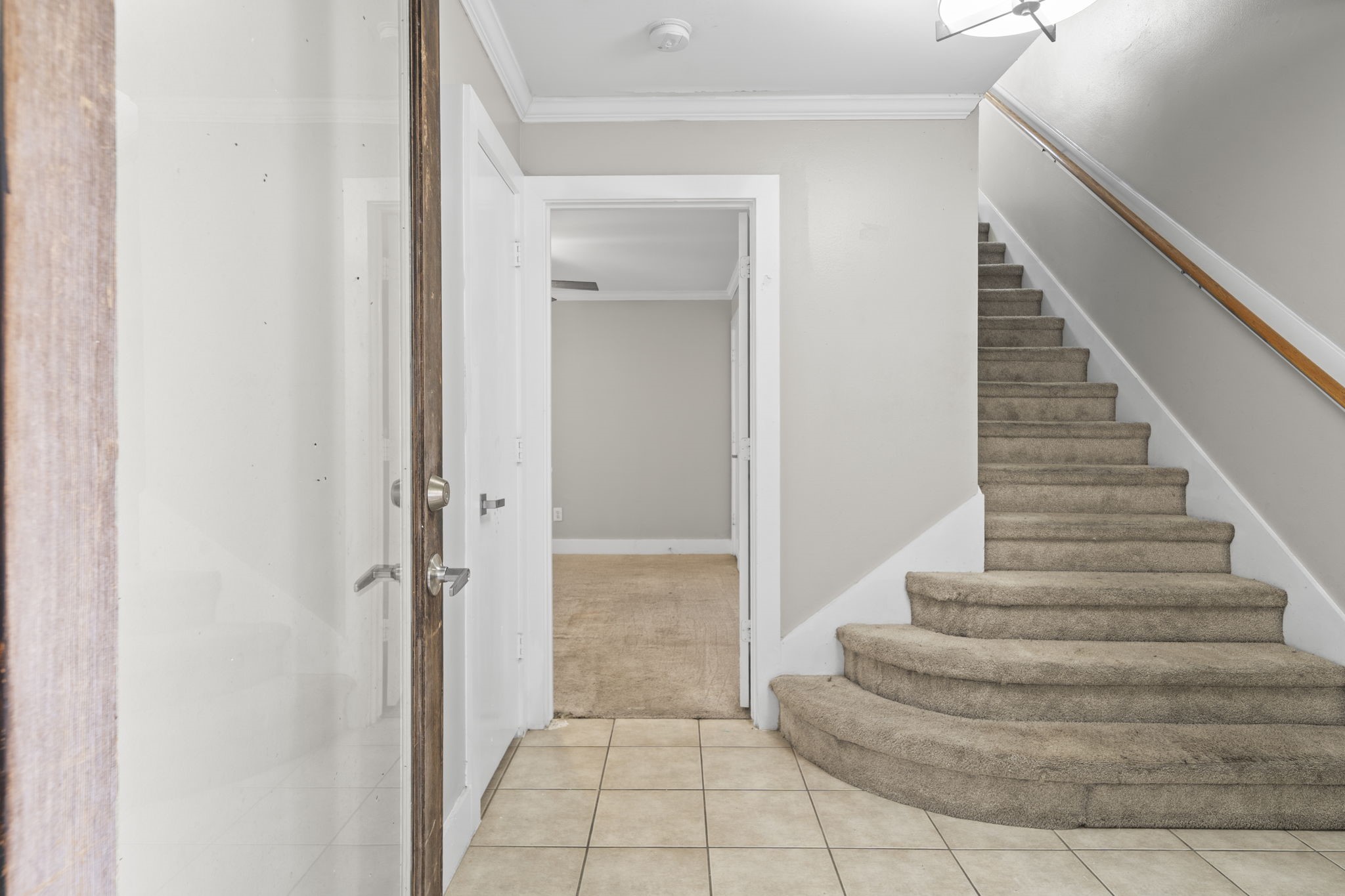 2154 Arabelle Street Houston, TX 77007 - Photo 13 of 45 The foyer introduces the home with a clean, defined entry and a sense of separation from the main living areas above. It creates a natural transition into the three-story layout.