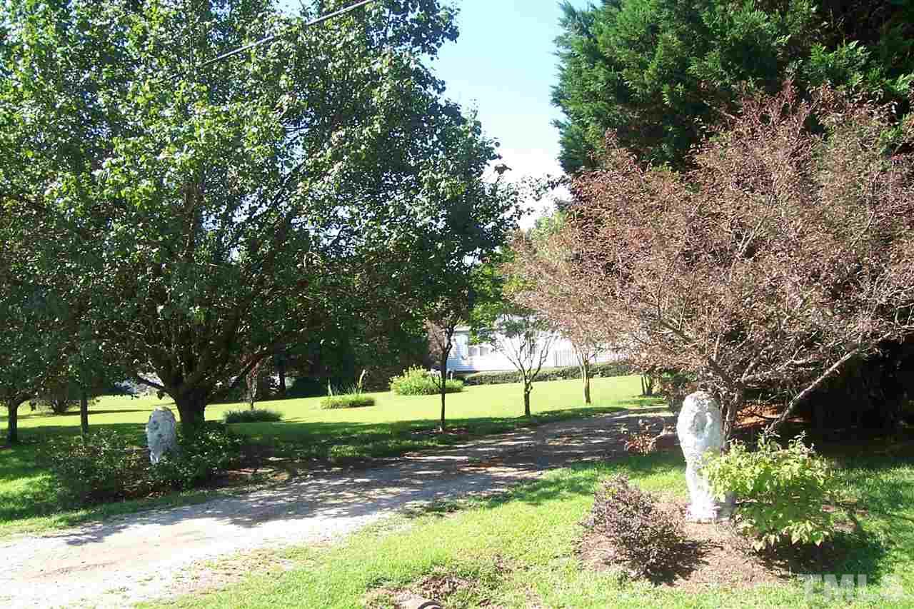 371 Lipscomb Road Angier, NC 27501 - Photo 8 of 9 a view of a yard with a tree