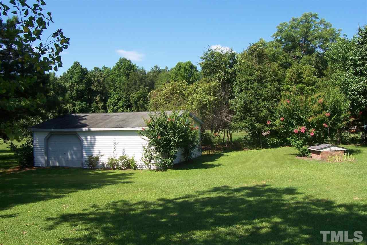 371 Lipscomb Road Angier, NC 27501 - Photo 9 of 9 a view of a backyard with plants and a garden