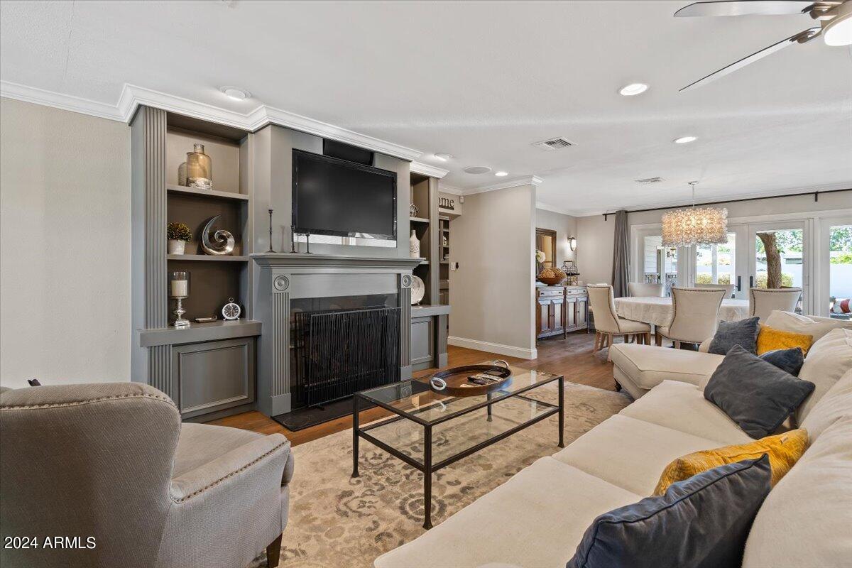 3841 East Elm Street Phoenix, AZ 85018 - Photo 12 of 72 a living room with furniture and a flat screen tv