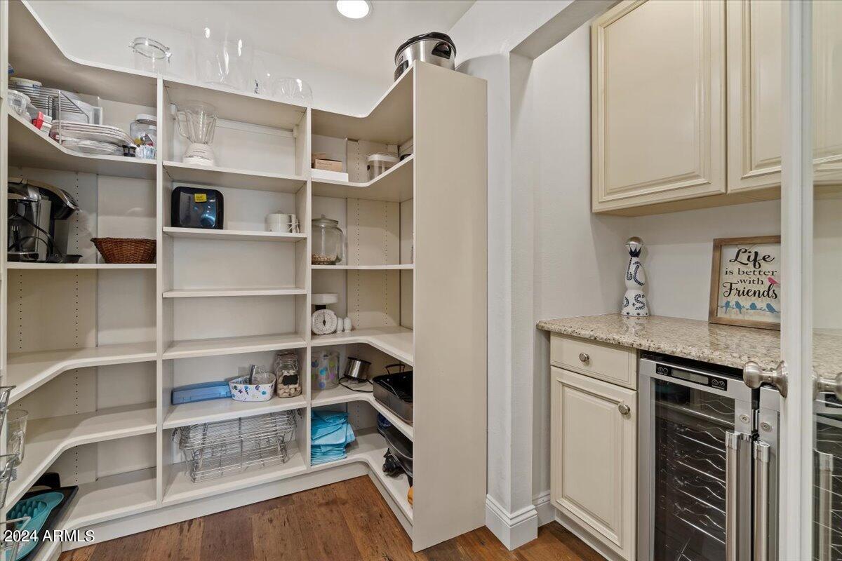 3841 East Elm Street Phoenix, AZ 85018 - Photo 25 of 72 a view of a kitchen with fridge and rack